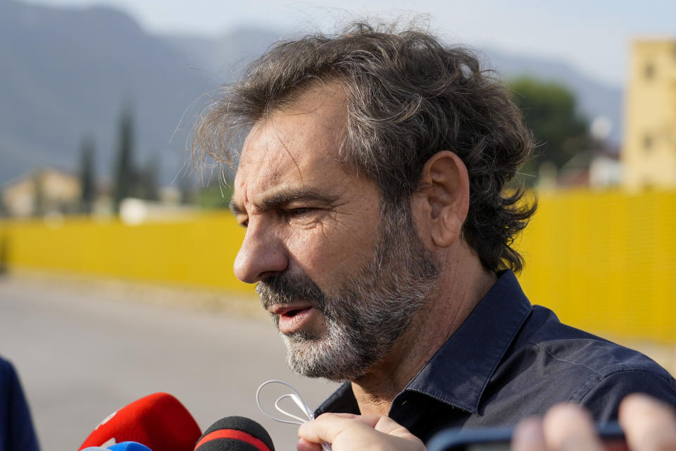 Open Arms founder Oscar Camps talks to the media as he arrives at a at Palermo's court room where a trial against former Italian minister of interior Matteo Salvini, accused for the kidnapping of migrants, is being held, Saturday, Oct. 23, 2021. Salvini is accused of kidnapping more than one hundred migrants and keeping them for weeks on board of the small Open Arms rescue boat in front of the coasts of Lampedusa, after refusing to let it dock in an Italian port, in 2019. (AP Photo/Gregorio Borgia)