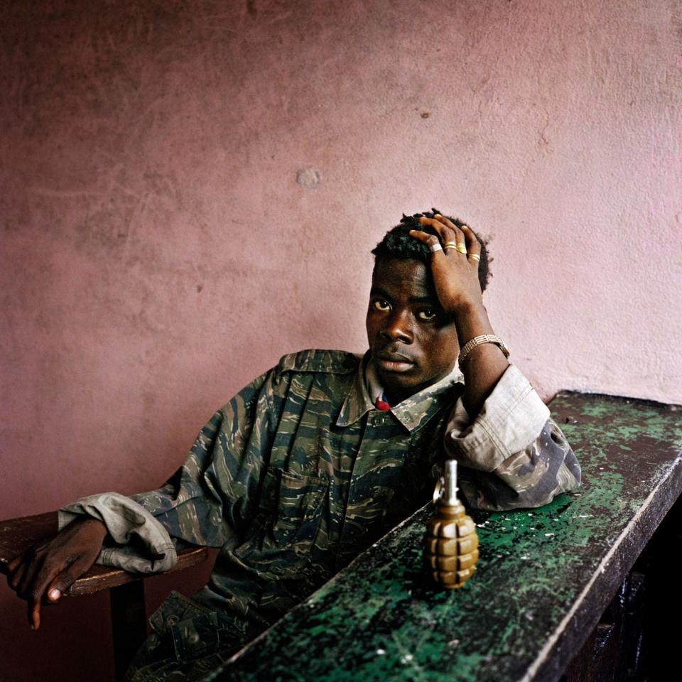 Young rebel fighter and hand grenade.16.06.03.  Tubmanberg.  Liberia.  (TIM A HETHERINGTON)