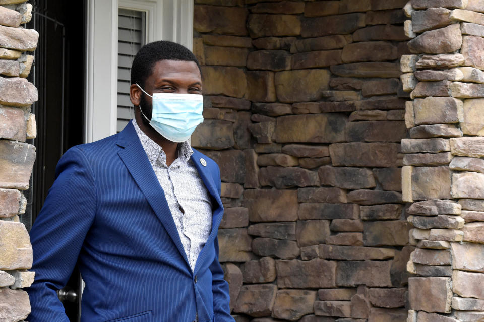 South Carolina state Rep. Kambrell Garvin stands at the entry of his home on Monday, June 8, 2020, in Blythewood, S.C. Garvin, a Democrat, is recovering from COVID-19, an issue that has created a partisan divide in state legislatures across the U.S. (AP Photo/Meg Kinnard)