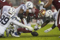 San Francisco 49ers quarterback Jimmy Garoppolo, middle, loses a fumble between Indianapolis Colts defensive tackle DeForest Buckner (99), defensive end Al-Quadin Muhammad (97) and defensive end Kwity Paye, right, who recovered the ball, during the second half of an NFL football game in Santa Clara, Calif., Sunday, Oct. 24, 2021. (AP Photo/Tony Avelar)