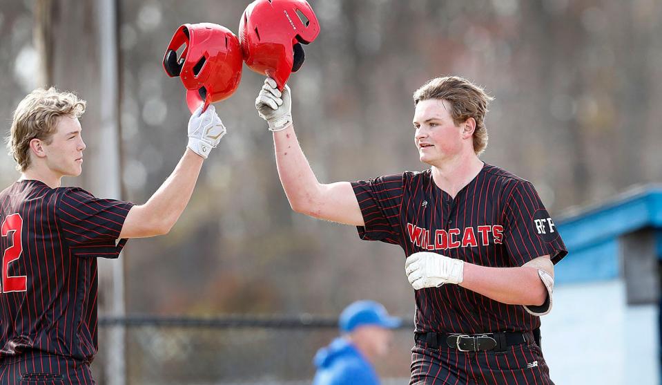Milton starting pitcher Charles Walker, right, is congratulated by teammate Owen McHugh after Walker's solo home run against Braintree on Monday, April 25, 2022.