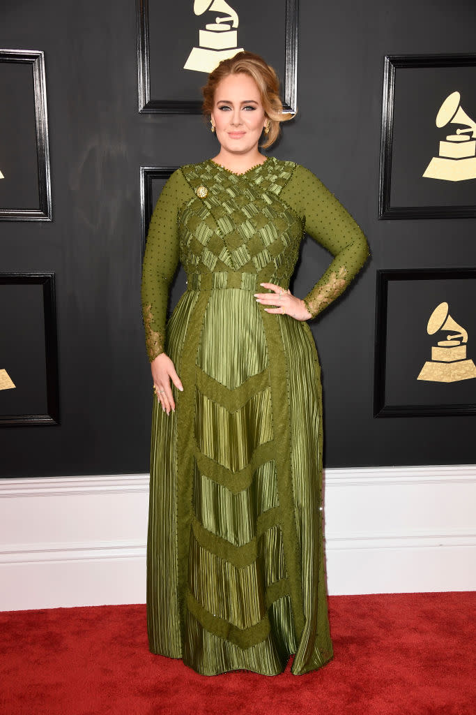 <p>Adele owned the Red Carpet in a flowing green, long-sleeved Givenchy gown. She pulled her hair up into a sexy updo and complemented her overall look with neutral makeup. </p>