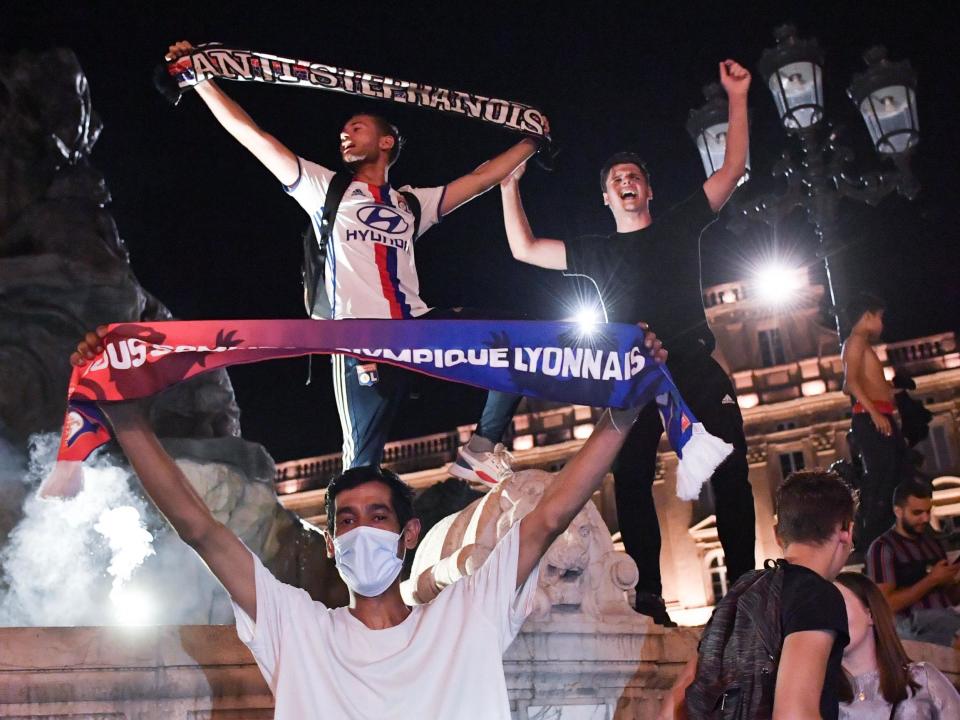Lyon fans celebrate victory over Juventus in the streets of Lyon: AFP