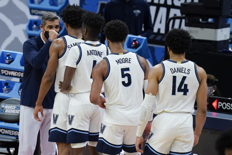 Villanova head coach Jay Wright greets his players as they are taken out during the second half of a second-round game against North Texas in the NCAA men's college basketball tournament at Bankers Life Fieldhouse, Sunday, March 21, 2021, in Indianapolis. Villanova won 84-61. (AP Photo/Darron Cummings)