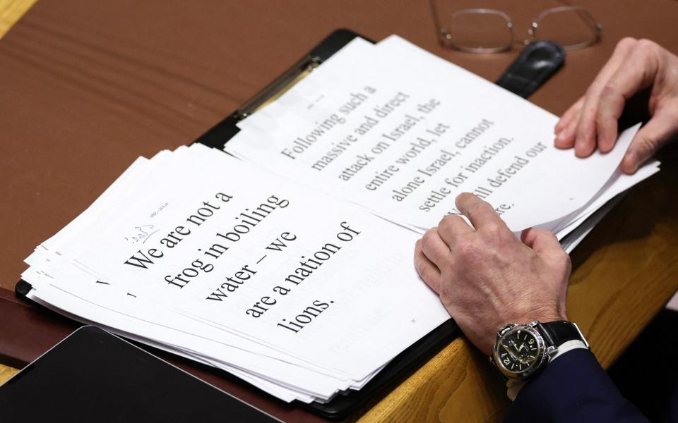 Israeli Ambassador to the UN Gilad Erdan looks at notes as he delivers remarks during a United Nations Security Council meeting
