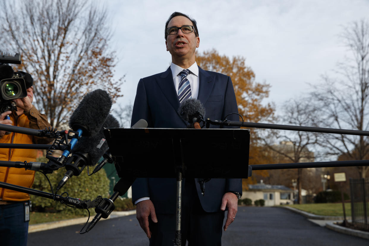 Treasury Secretary Steve Mnuchin talks with reporters about trade negotiations with China, at the White House, Monday, Dec. 3, 2018, in Washington. (AP Photo/Evan Vucci)