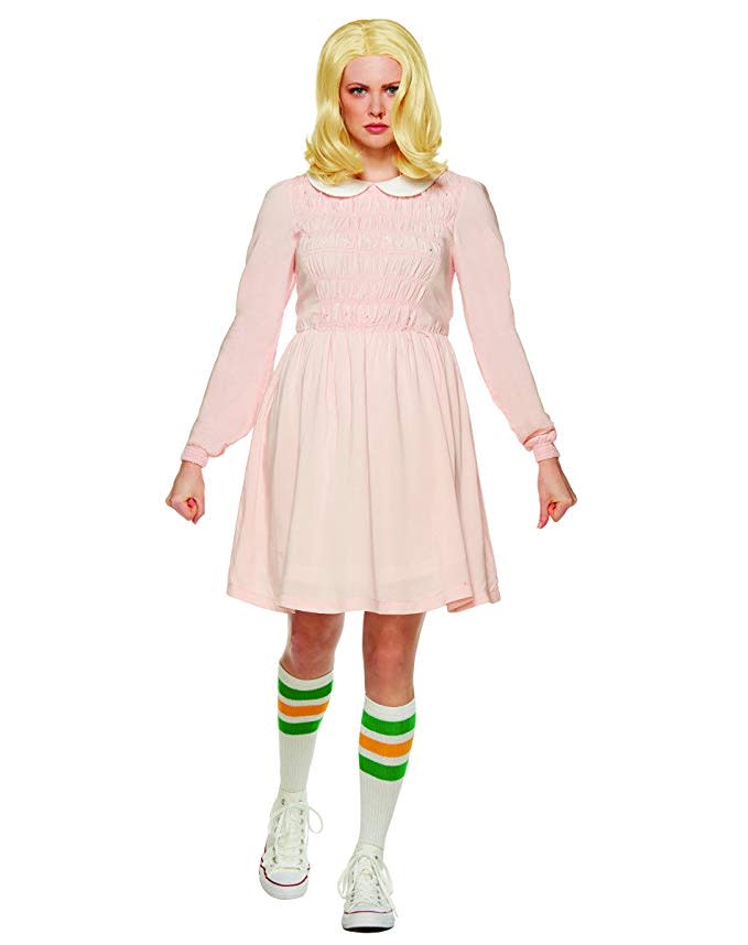 a woman wearing a pink dress and socks as an eleven halloween costume on a white background