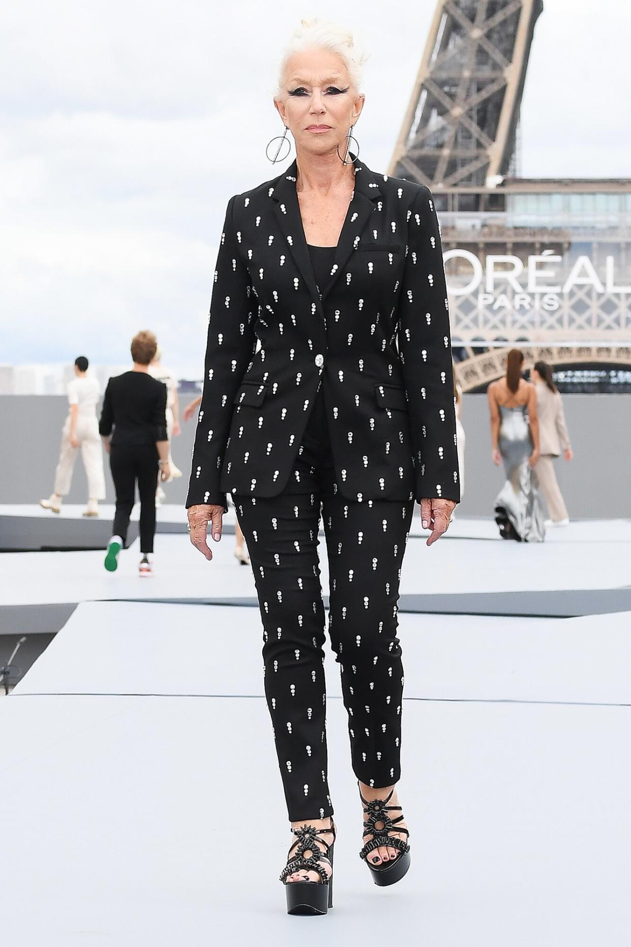 Helen Mirren walks the runway during the "Le Defile L'Oreal Paris 2021" Womenswear Spring/Summer 2022 show as part of Paris Fashion Week on October 03, 2021 in Paris, France.