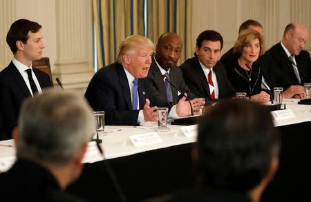 U.S. President Donald Trump speaks during a meeting with manufacturing CEOs at the White House in Washington, U.S. February 23, 2017. Flanking Trump are his senior advisor Jared Kushner (L) and Merck CEO Ken Frazier (3rd L). REUTERS/Kevin Lamarque