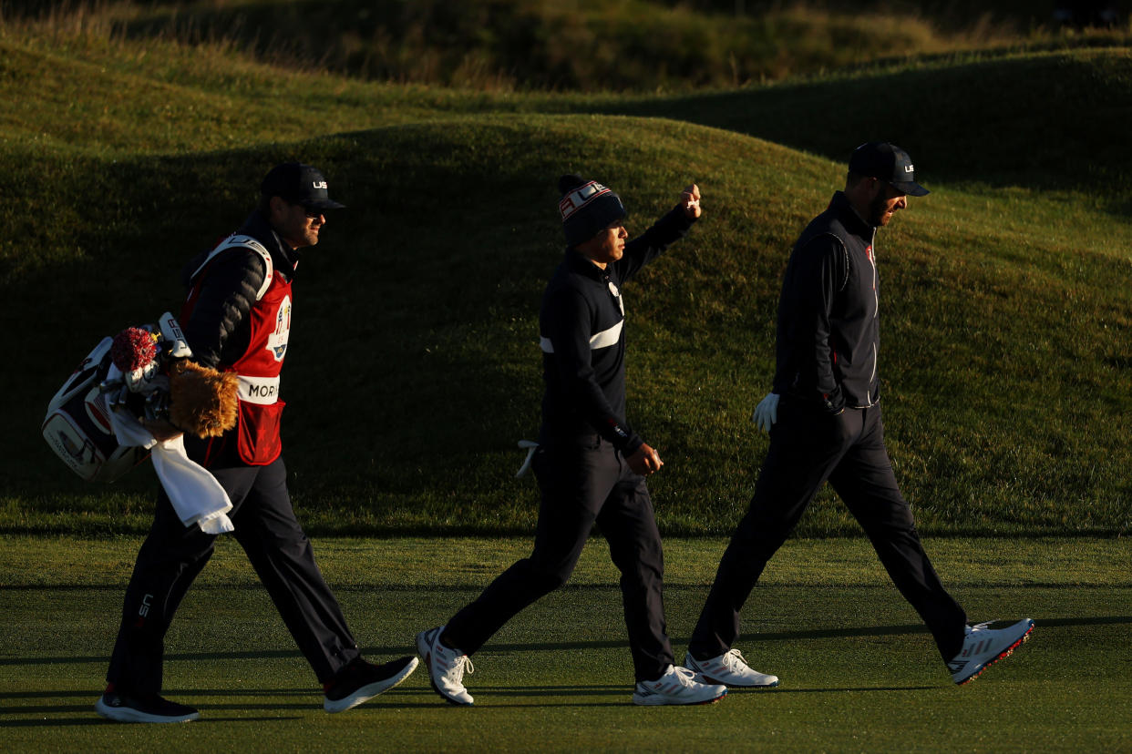 KOHLER, WISCONSIN - SEPTEMBER 25: Collin Morikawa of team United States (L) and Dustin Johnson of team United States walk down the first hole during Saturday Morning Foursome Matches of the 43rd Ryder Cup at Whistling Straits on September 25, 2021 in Kohler, Wisconsin. (Photo by Warren Little/Getty Images)