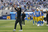 Los Angeles Chargers head coach Brandon Staley celebrates after a touchdown catch by tight end Donald Parham Jr. (89) during the first half of an NFL football game against the Miami Dolphins Sunday, Sept. 10, 2023, in Inglewood, Calif. (AP Photo/Mark J. Terrill)