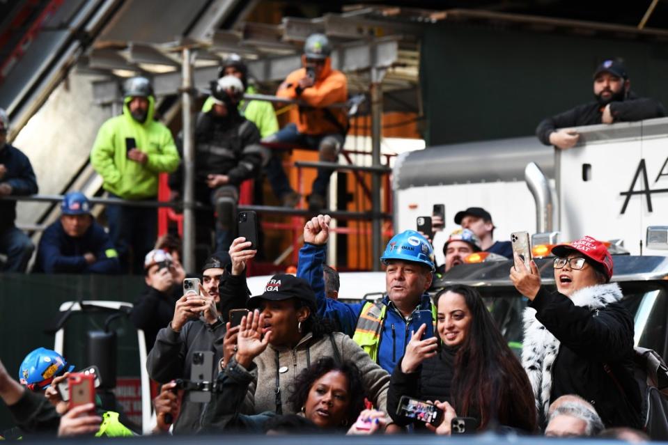 Supporters cheers outside the construction site of the new JP Morgan Chase building. Matthew McDermott