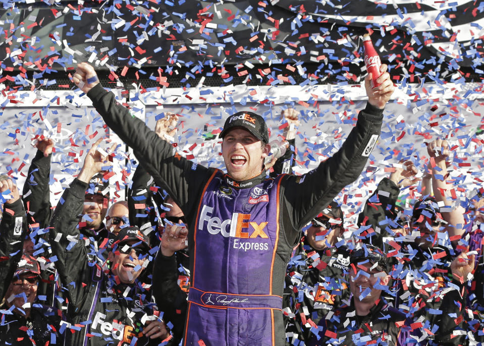 FILE - In this Sunday, Feb. 21, 2016, file photo, Denny Hamlin celebrates in Victory Lane after winning the NASCAR Daytona 500 Sprint Cup Series auto race at Daytona International Speedway in Daytona Beach, Fla. Hamlin is on the verge of announcing some sort of ownership group as the three-time Daytona 500 winner prepares for his future. (AP Photo/Chuck Burton, File)