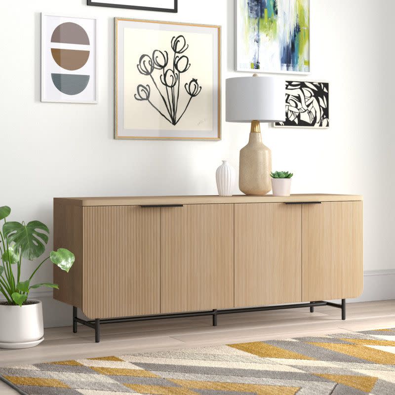 <p><a href="https://go.redirectingat.com?id=74968X1596630&url=https%3A%2F%2Fwww.wayfair.com%2F--%2Fpdp%2Fwilla-arlo%25e2%2584%25a2-interiors--ludlow-69-wide-sideboard-x110634546-l161-w009523435.html&sref=https%3A%2F%2F" rel="nofollow noopener" target="_blank" data-ylk="slk:Shop Now;elm:context_link;itc:0;sec:content-canvas" class="link rapid-noclick-resp">Shop Now</a></p><p>Ludlow Sideboard</p><p>wayfair.com</p><p>$399.99</p>