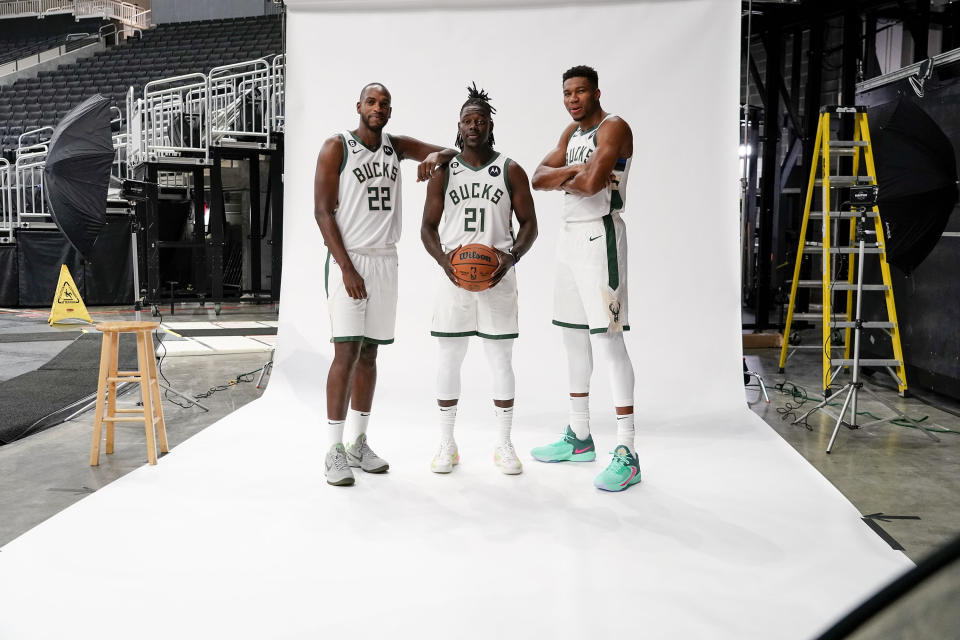 Milwaukee Bucks' Khris Middleton (22), Giannis Antetokounmpo, right, and Jrue Holiday (21) pose for a photograph at the NBA basketball team's media day Sunday, Sept. 25, 2022, in Milwaukee. (AP Photo/Morry Gash)