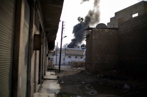 Smoke billows from a site bombed by the Syrian Air Force in the rebel-controlled town of Al-Bab, 35 kilometers northeast of Aleppo. Fighting raged in Syria's two biggest cities on Sunday as UN-Arab League envoy Lakhdar Brahimi ended his first visit to the country on a peace mission a rebel commander said was doomed to fail