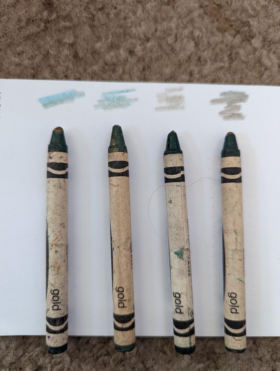 Gold crayons that have turned green