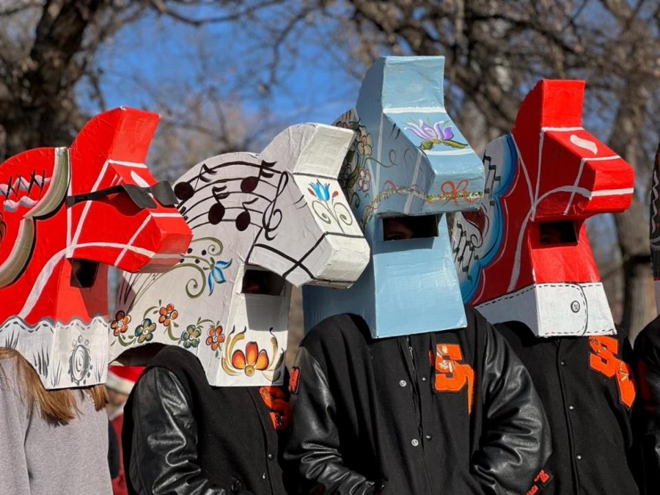 Students from Smoky Valley Public Schools wear Dala horse heads as they participate in a previous year's Snowflake Parade in downtown Lindsborg.
