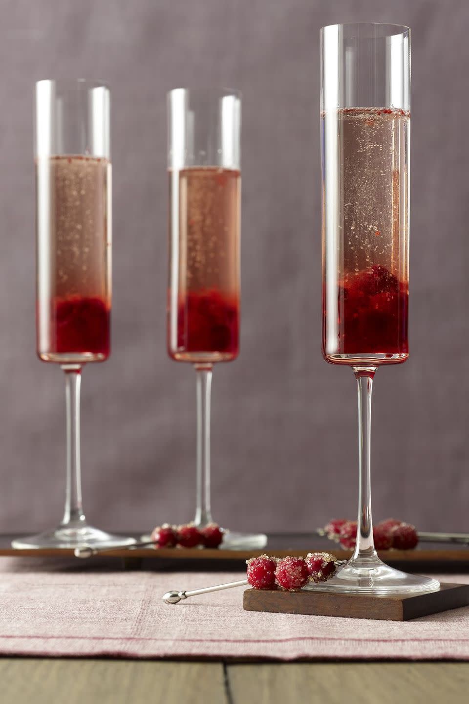 <p>For fans of champagne or prosecco, cava is an excellent, slightly less common alternative. Add some colorful cranberries to the mix and you have a festive, wintery beverage that every adult is sure to love.</p><p>Get the <strong><a href="https://www.womansday.com/food-recipes/food-drinks/recipes/a28393/cranberry-cava-cocktails-recipe/" rel="nofollow noopener" target="_blank" data-ylk="slk:Cranberry Cava Cocktails recipe;elm:context_link;itc:0;sec:content-canvas" class="link ">Cranberry Cava Cocktails recipe</a></strong>.</p>