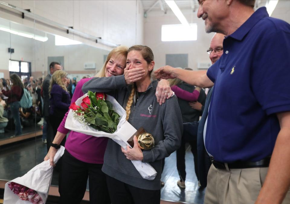 Cypress Lake High School teacher Sarah Thornburg reacts after receiving a Golden Apple award Thursday morning. Members of the Foundation for Lee County Public Schools surprised six teachers with the prestigious Golden Apple Award on Thursday, March 14, 2024. The Golden Apple Teacher Recognition Program was created by the foundation to help enhance and enrich public education by recognizing and rewarding excellence in teaching. The winners included: Christine Bartz of Pine Island Elementary School; Sara Kizzire of Lehigh Senior High; Jill Klausing of Dunbar High School; Jessica Lisi of Tanglewood Elementary; Michelle Smith of Lehigh Senior High; and Sarah Thornburg of Cypress Lake High School.