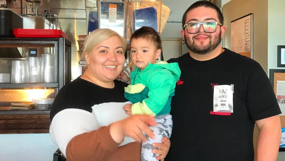 Nadine Iniquez and Luis Cortez, the married couple behind new Morro Bay restaurant Rock Tacos, pose for a picture with their 19-month-old son, Jose Emiliano.