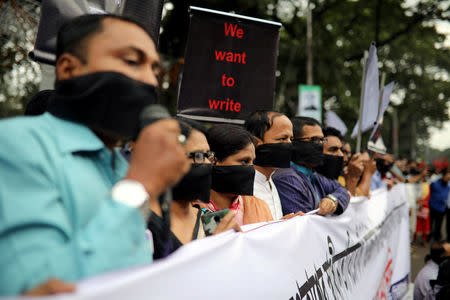Journalists hold banners and placards as they protest against the newly passed Digital Security Act in front of the Press Club in Dhaka, Bangladesh, October 11, 2018. REUTERS/Mohammad Ponir Hossain