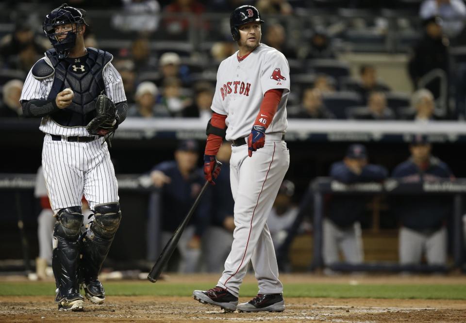 New York Yankees catcher Brian McCann, left, looks to the home plate umpire as Boston Red Sox's A.J. Pierzynski appeals to the first base umpire after striking out swinging in the sixth inning of a baseball game at Yankee Stadium in New York, Thursday, April 10, 2014. (AP Photo/Kathy Willens)