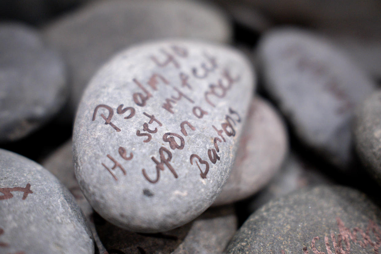 Oklahoma Baptist University students were encouraged to write scriptures and inspirational messages on rocks that will be used later for an art installation at the private Christian school in Shawnee.