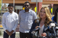 Joleen Youngers, attorney representing former New Mexico State NCAA college basketball player Deuce Benjamin and his father William Benjamin, seen in the background, speaks at a news conference in Las Cruces, N.M., Wednesday, May 3, 2023. The Benjamins and former Aggie player Shak Odunewu discussed the lawsuit they filed alleging teammates ganged up and sexually assaulted them multiple times, while their coaches and others at the school didn't act when confronted with the allegations. (AP Photo/Andres Leighton)