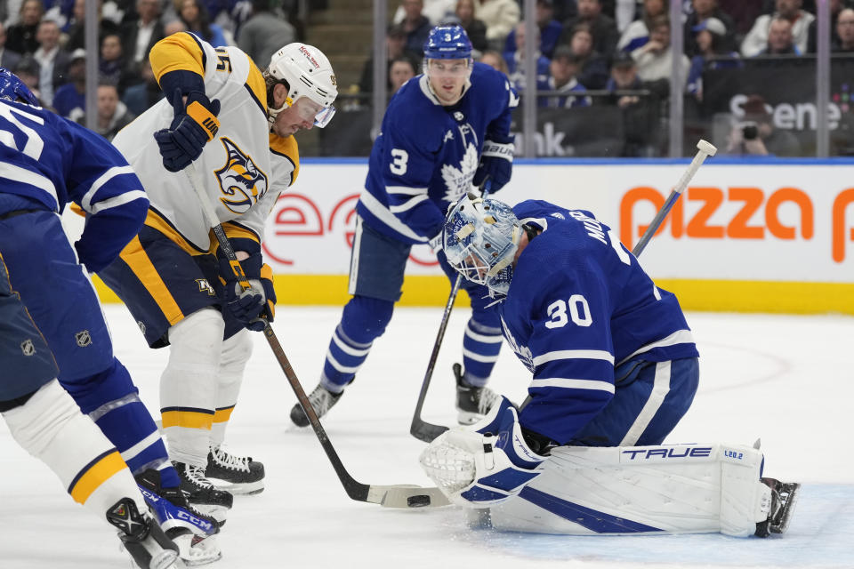 Nashville Predators center Matt Duchene (95) is stopped Toronto Maple Leafs goaltender Matt Murray (30) during the first period of an NHL hockey game, Wednesday, Jan. 11, 2023 in Toronto. (Frank Gunn/The Canadian Press via AP)