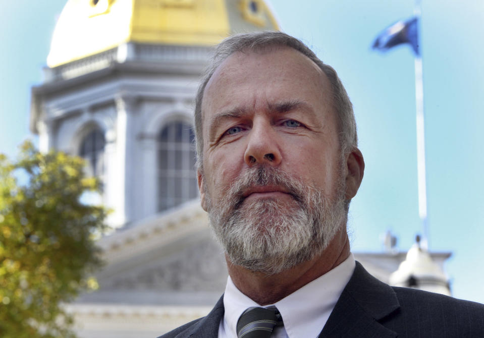 FILE - In this Oct. 24, 2013, file photo, State Rep. Renny Cushing poses in front of the state capitol in Concord, N.H. The killing of George Floyd has sparked broader discussions of race and discrimination in state legislatures across the country. Affirmative action, reparations and designating racism as a public health crisis are generating debate and a fair amount of controversy. (AP Photo/Jim Cole, File)