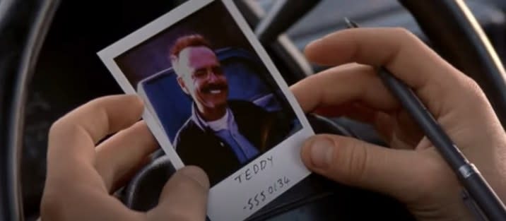 Teddy's phone number on a polaroid in Memento