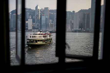 FILE PHOTO: A cross-harbour ferry leaves the pier in Tsim Sha Tsui in Hong Kong