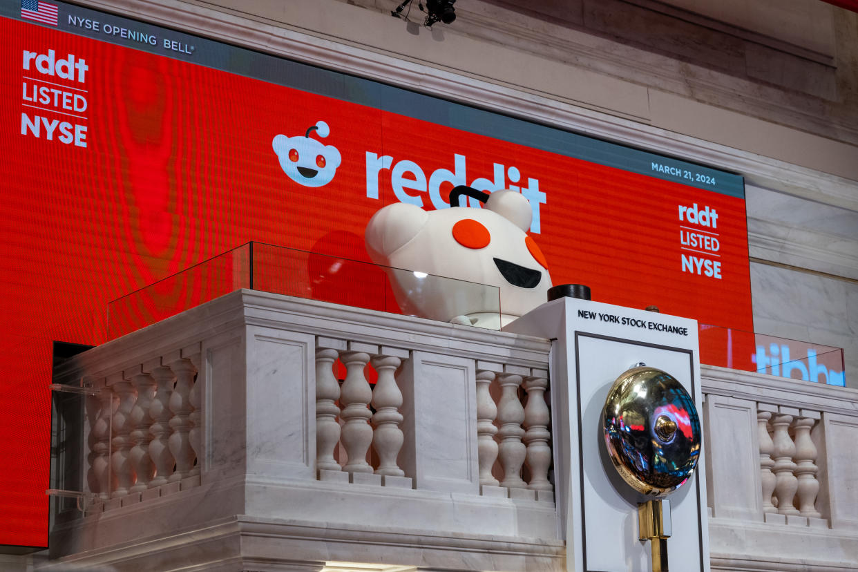 NEW YORK, NEW YORK - MARCH 21: Reddit’s mascot 'Snoo' rings the opening bell on the floor of the New York Stock Exchange with employees (NYSE) as it prepares for Reddit's initial public offering (IPO) on March 21, 2024 in New York City. The social media platform Reddit priced its IPO in the range of $31 to $34 per share on Wednesday. Reddit has raised  $748 million and its IPO share price will be determined later in the trading day.  (Photo by Spencer Platt/Getty Images)