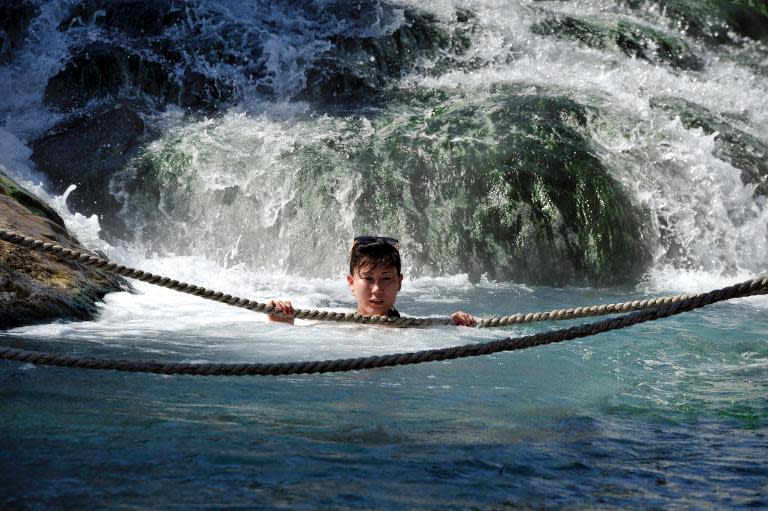 A woman bathes in a hot spring at Thermopylae, one of Greece's 700 hot springs known to have curative properties