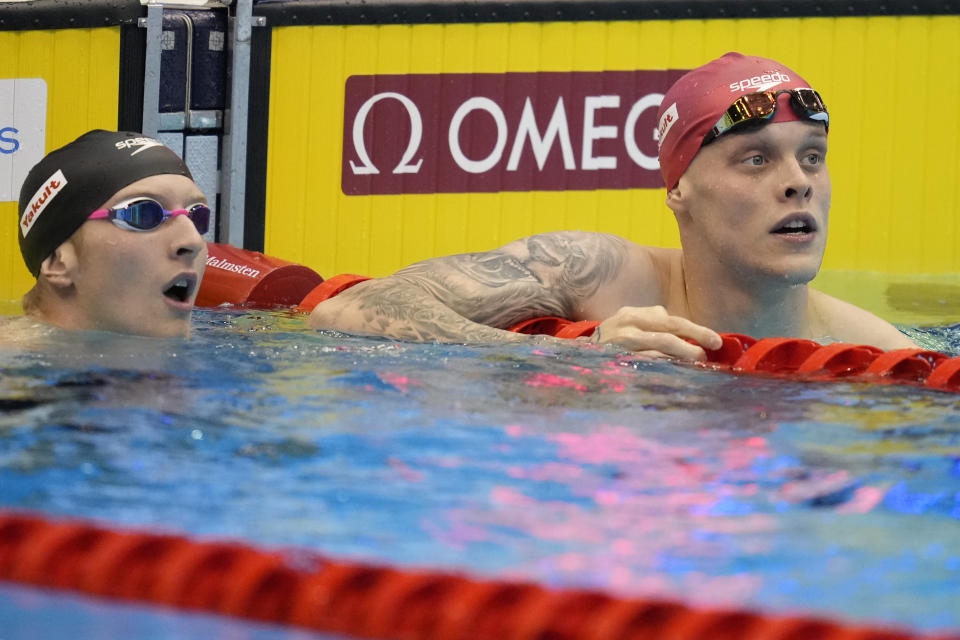 Matthew Richards of Britain, right, and Kieran Smith of United States react after competing in the men's 200 meter freestyle semi-final at the World Swimming Championships in Fukuoka, Japan, Monday, July 24, 2023. (AP Photo/Lee Jin-man)