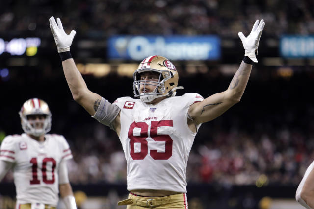 San Francisco 49ers tight end George Kittle runs the ball after a