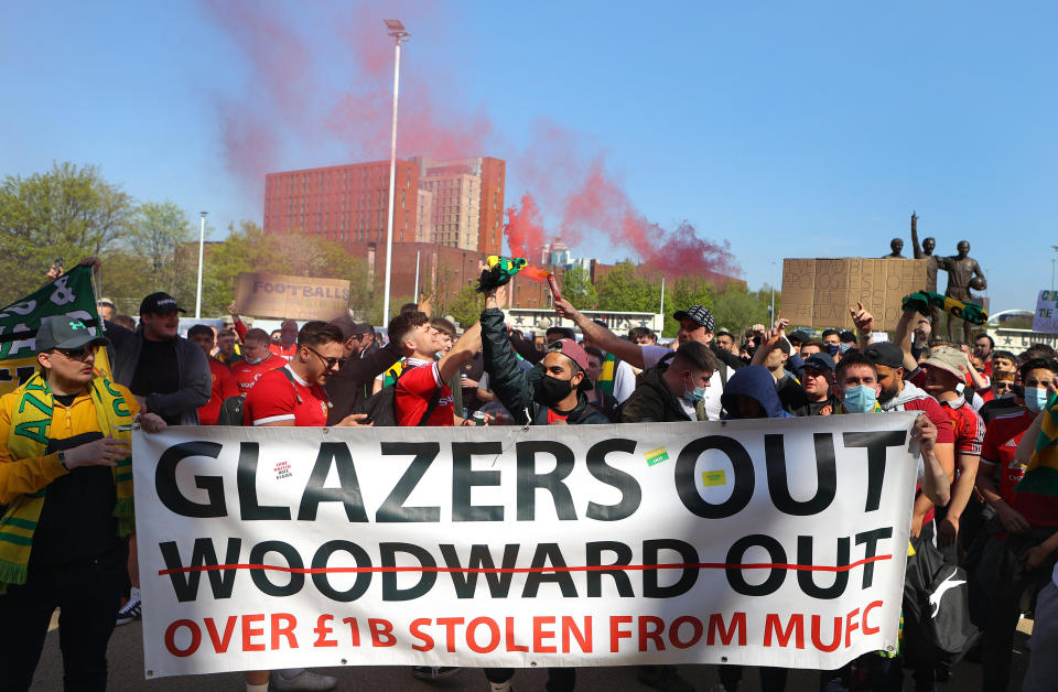 Manchester United supporters protest against the Glazer family's ownership during a protest against the club's ownership, outside the Old Trafford stadium, April 24, 2021 in Manchester, England. / Credit: James Gill/Danehouse/Getty