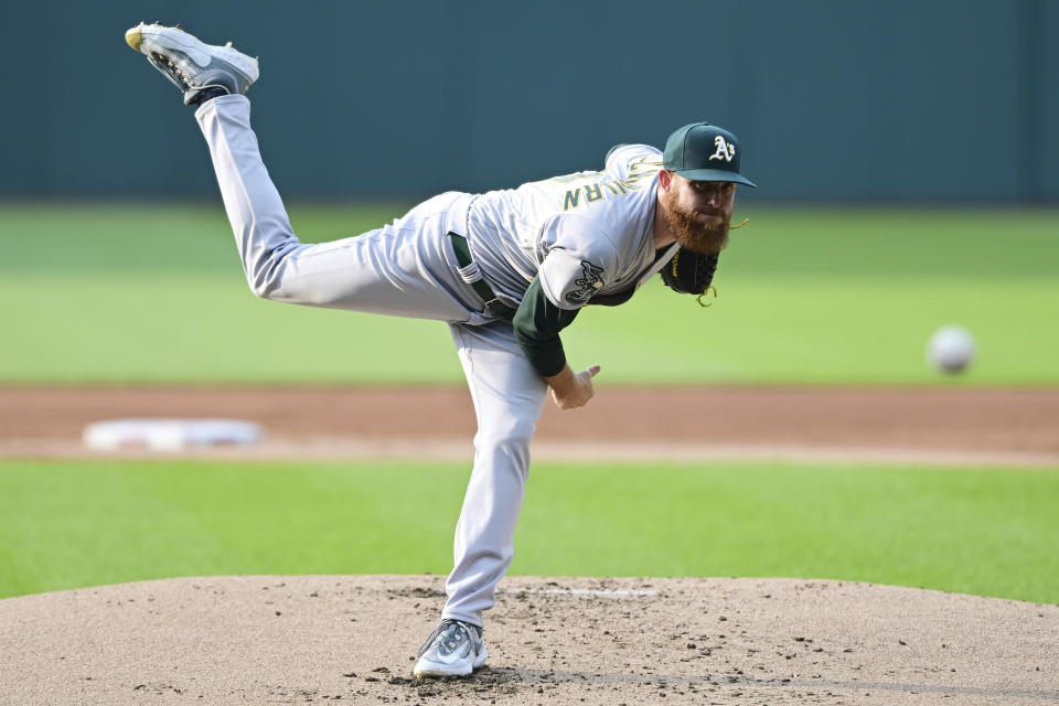 Oakland Athletics starting pitcher Paul Blackburn delivers during the first inning of a baseball game against the Cleveland Guardians, Wednesday, June 21, 2023, in Cleveland. (AP Photo/David Dermer)