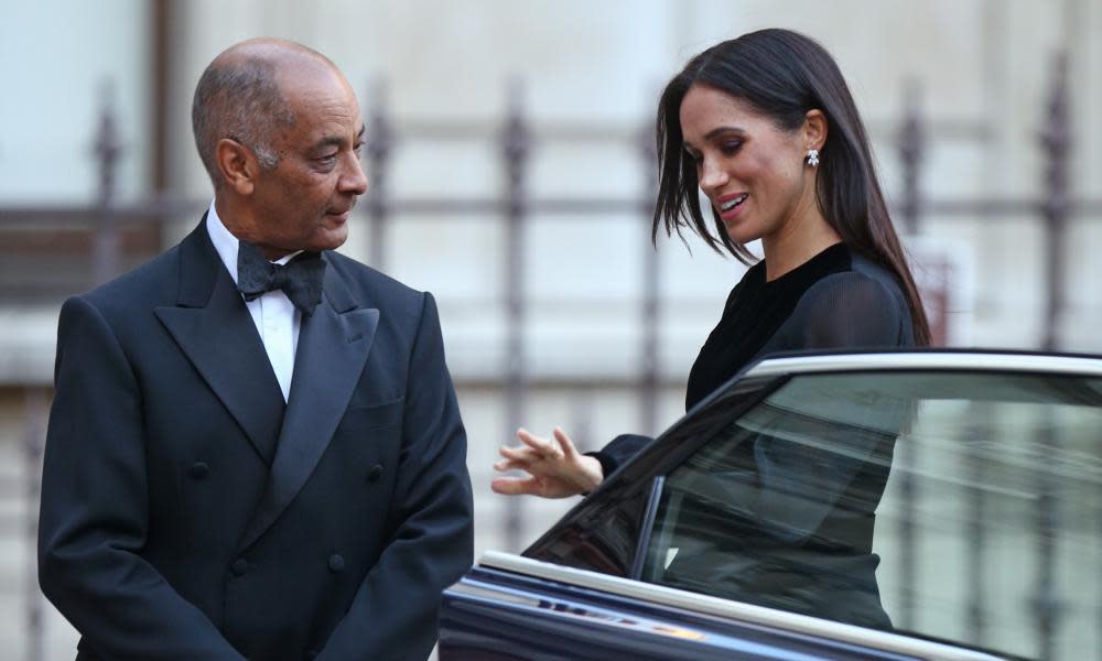 The Duchess of Sussex is met by the lord lieutenant of London, Sir Kenneth Olisa, at the Royal Academy.