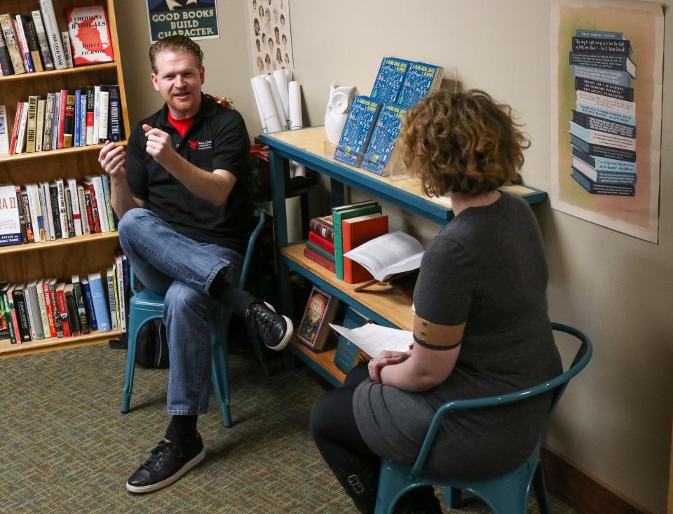 Margaret Christopherson, reporter from the Journal & Courier, interviews Adam J. Kuban's, professor of Journalism at Ball State, about his new book "Facing Social Justice in Sports", on Friday, Dec. 2, 2022, in Lafayette, Ind.