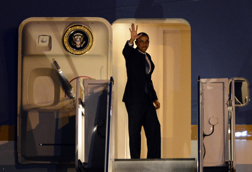 President Barack Obama waves as he boards Air Force One on Thursday, Jan. 30, 2014, in Nashville, Tenn. Earlier Obama delivered a speech at McGavock High School. (AP Photo/Mark Zaleski)