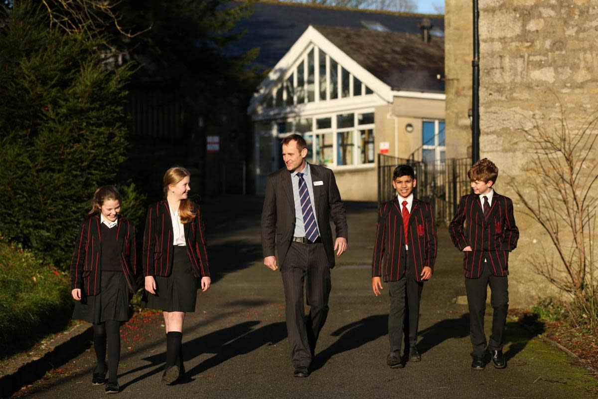 Headmaster Sam Hart and pupils <i>(Image: Giggleswick School)</i>