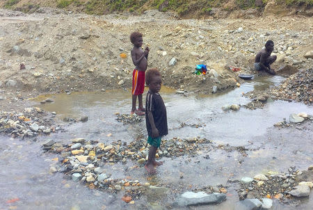 A supplied image shows locals searching for gold in the Jaba River near the former Bougainville Copper Limited's (BCL) Panguna mining operation located on the Pacific Ocean island of Bougainville, Papua New Guinea, October 19, 2016. Picture taken October 19, 2016. Renzie Duncan/Handout via REUTERS