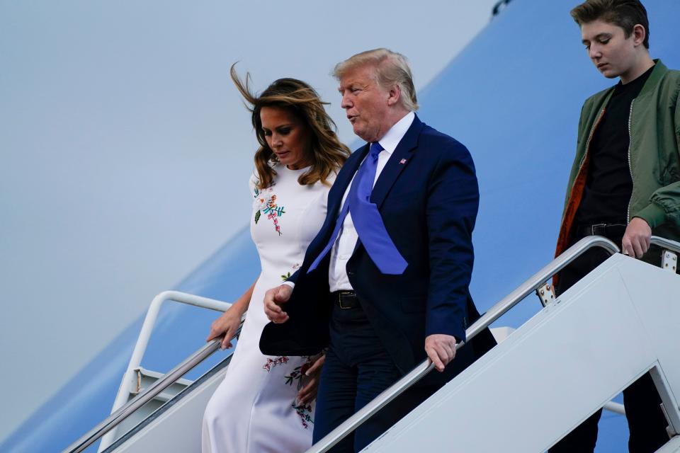 Donald Trump and Melania Trump arrive at Palm Beach International Airport in 2020.