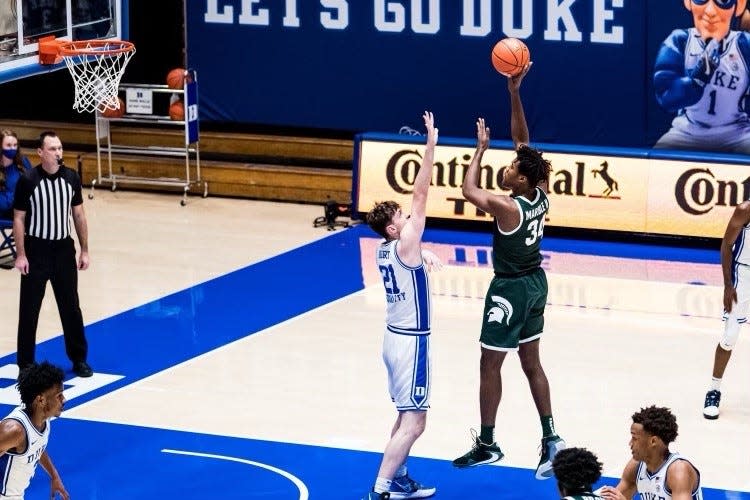 Michigan State forward Julius Marble (34) shoots over Duke's Matthew Hurt during the Spartans' 75-69 win on Tuesday, Dec. 1, 2020 in Durham, North Carolina.