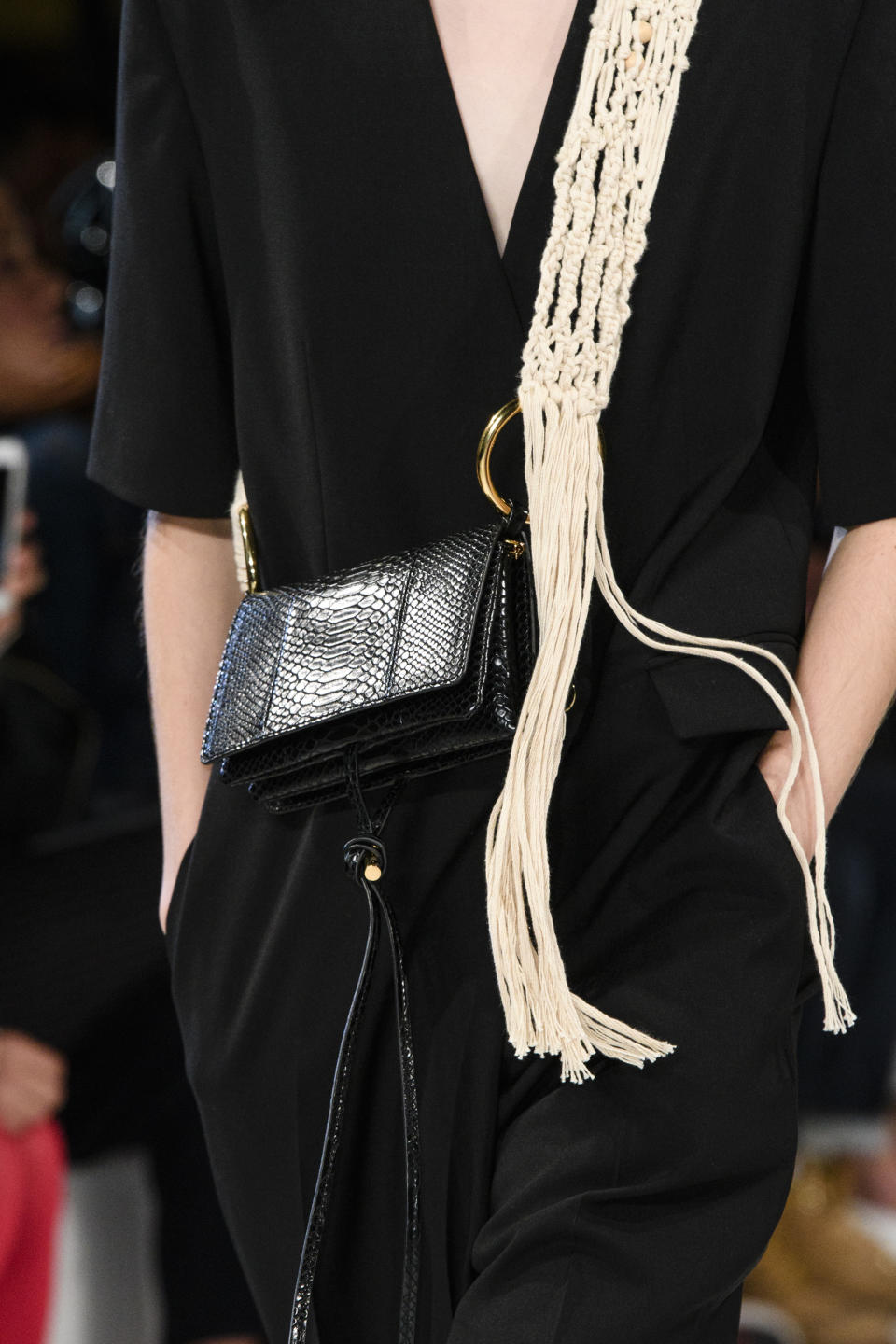 <p><i>Crossbody black handbag with woven rope strap from the SS18 Stella McCartney collection. (Photo: ImaxTree) </i></p>