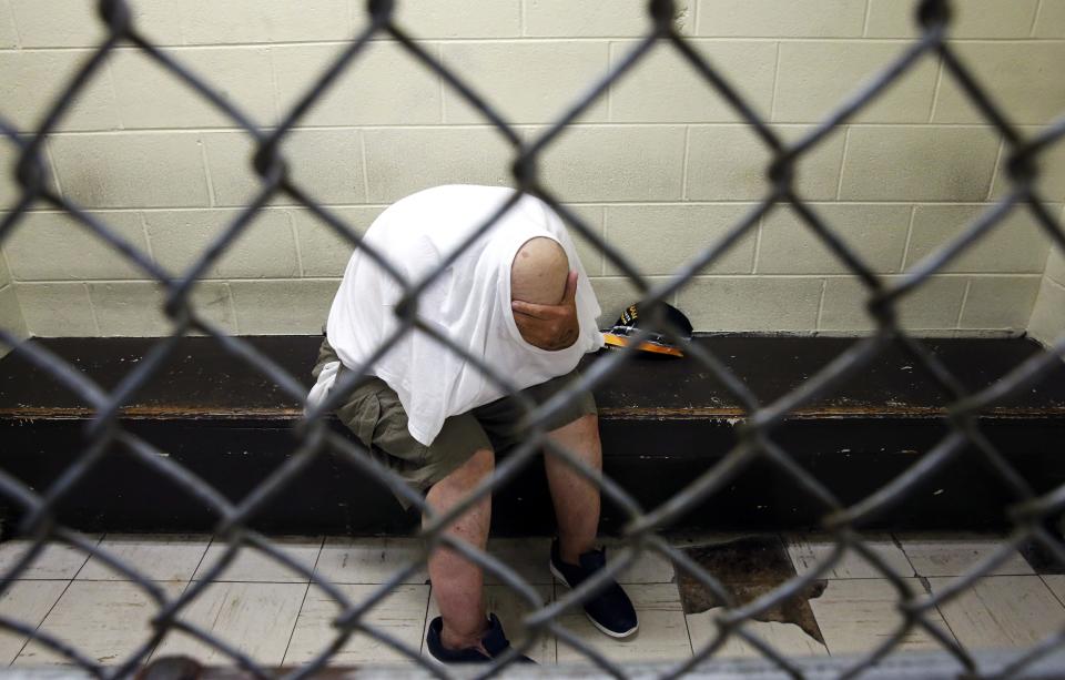 A U.S. veteran with post-traumatic stress, sits in a segregated holding pen at Chicago's Cook County Jail after he was arrested on a narcotics charge.