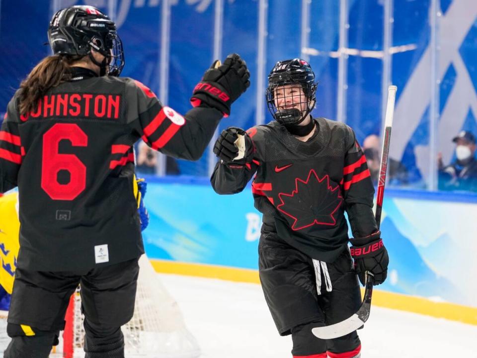 Canada forward Sarah Fillier, right, celebrates a goal during a game against Sweden on Friday. (Andrew Lahodynskyj/The Canadian Press - image credit)