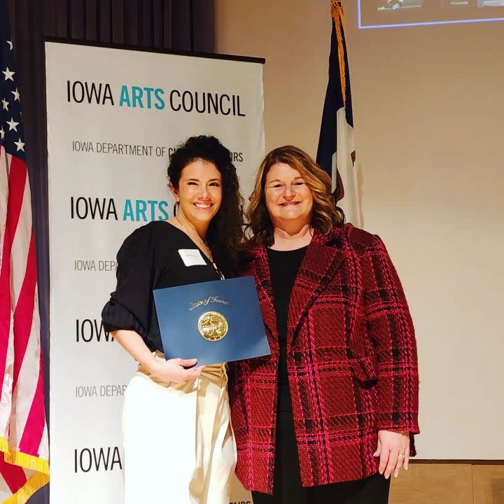 Torres, left, was honored March 1, 2023 in Des Moines by Chris Kramer, director of the Iowa Department Cultural Affairs.